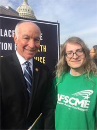 Connecticut Rep. Joe Courtney stands next to social worker Miriam Doyle.